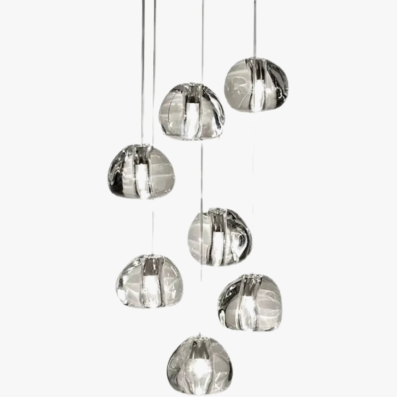 Seven rotating crystal LED pendant lights with abstract glass forms, modern chandelier by Maison Ornate.