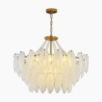 Maison Ornate Modern Crystal Chandelier with vintage tassels and feathers, warm luxurious lighting.