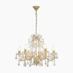 Six-light gold chandelier with ornate arms, crystal pendants, and chain suspension for ceilings.