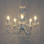 Five-light silver baroque chandelier with clear crystal accents and teardrop crystals on each arm.