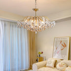 A Maison Ornate Modern Crystal Bedroom Chandelier features an adjustable chain and sparkling crystals.