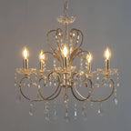 The Maison Ornate Baroque Chandelier has gold tassels, metal arms, and sparkling crystals.