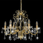 Ornate gold chandelier with candle-style bulbs, hanging crystal beads, and ceiling mount design.