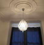 Maison Ornate Crystal Ball Chandelier with three drop shades and detailed ceiling medallion, brightly illuminated.