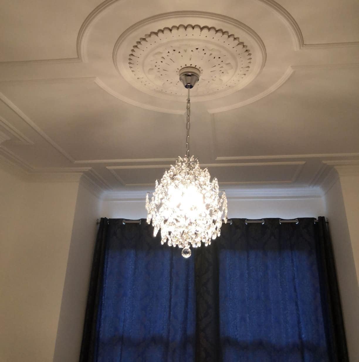 Maison Ornate Crystal Ball Chandelier with three drop shades and detailed ceiling medallion, brightly illuminated.