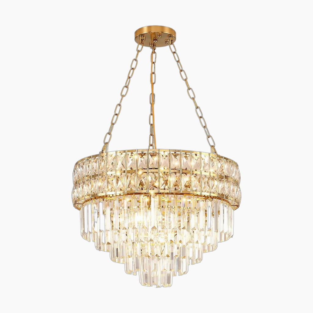 Round gold chandelier with K9 crystal prisms, suspended by three chains, emits warm glow.