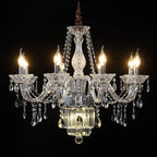 Six-arm European crystal chandelier with candle-shaped lights and ornate glass arms, adorned with K9-style crystals.