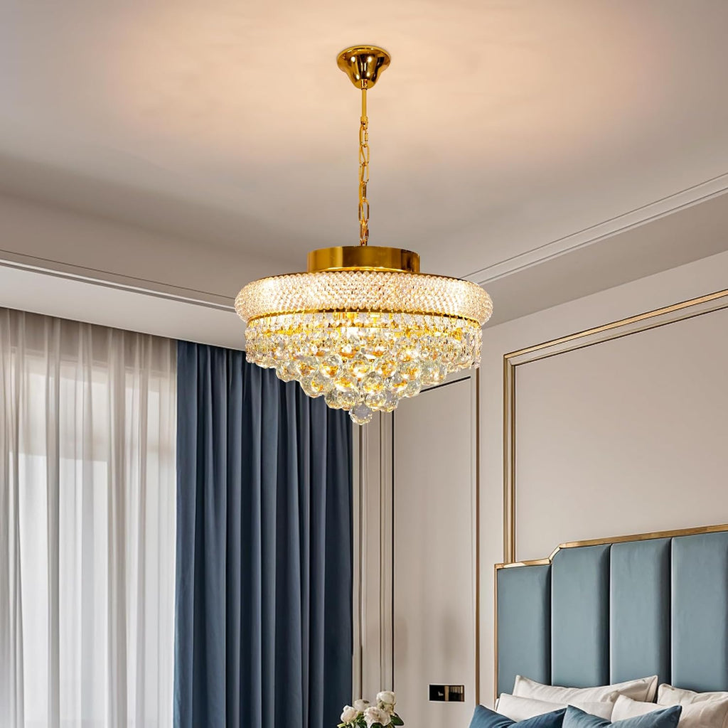 Modern round crystal gold chandelier by Maison Ornate with multi-tiered design and sparkling glass droplets.