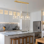 Elegant Adjustable Brass Crystal Pendant Light by Maison Ornate, suspended, showcasing refined crystal detailing.