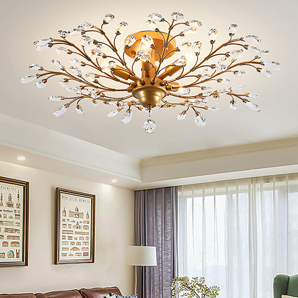 The Maison Ornate K9 Chandelier showcases gold, black, and silver arms with crystal droplets.