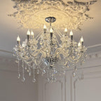 Maison Ornate Modern French White Crystal 15-Arm Chandelier with candle-shaped lit bulbs.