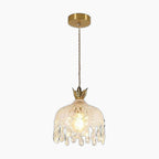 Gold-mounted crystal chandelier with braided cord and teardrop glass shade featuring crown-like details.