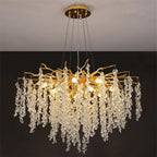 Modern crystal gold branch chandelier with cascading crystals; elegant, ornate, and luxurious lighting statement.