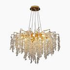 Gold-branch chandelier with cascading crystal droplets, wisteria-inspired design, circular mount, modern and elegant.