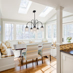 Maison Ornate Crystal Dining Room Chandelier with black metal drops, sparkling under natural skylight.