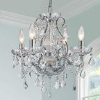 Maison Ornate Modern Crystal Chrome chandelier with four candle lights and sparkling crystal pendants.
