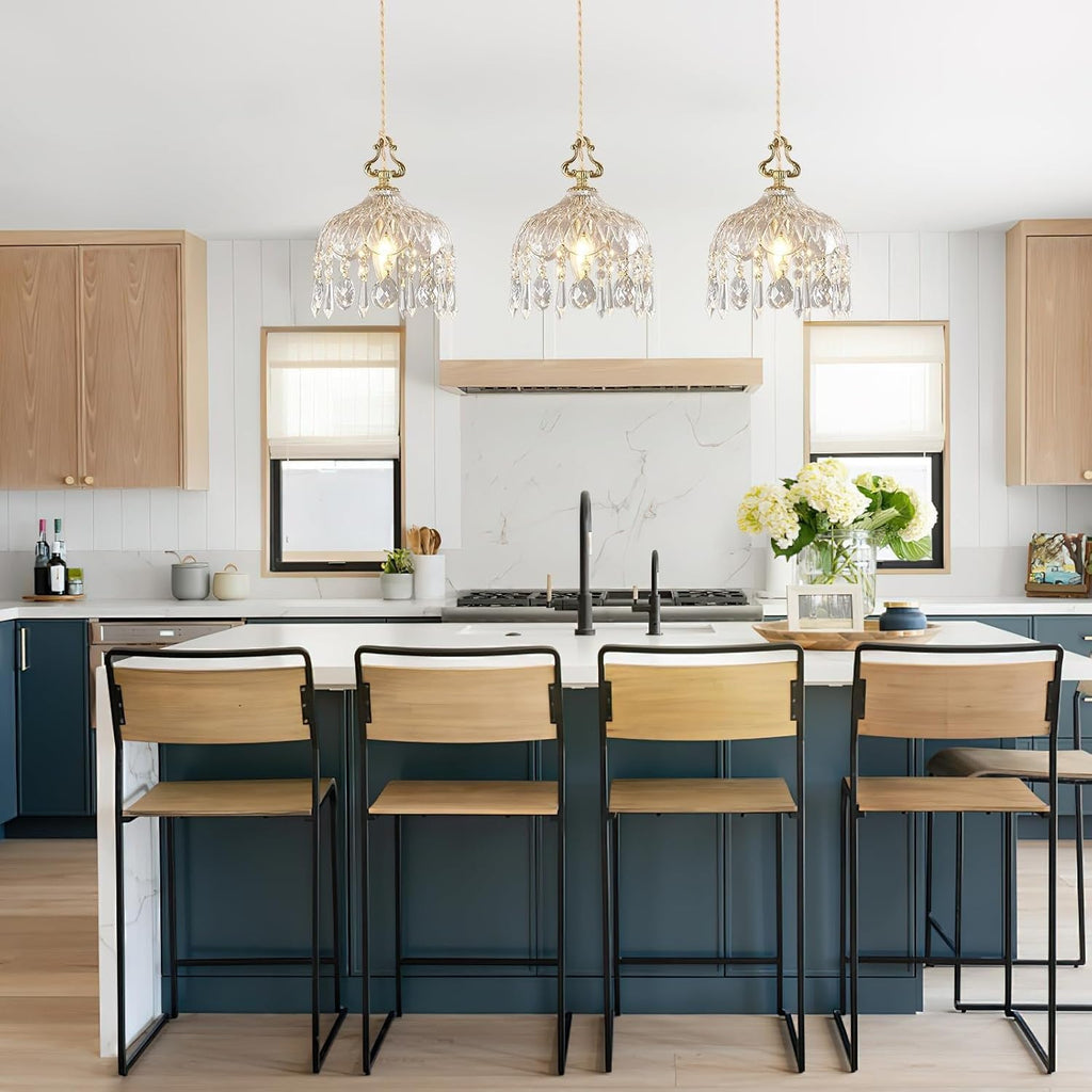 Maison Ornate’s Elegant Adjustable Brass Crystal Pendant Light featuring ornate detailing and gleaming crystal accents.
