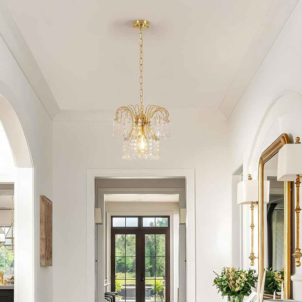 The Maison Ornate Modern Crystal Water Drop Gold E27 Chandelier sparkles with elegant crystal details.