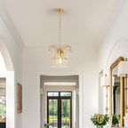 The Maison Ornate Modern Crystal Water Drop Gold E27 Chandelier sparkles with elegant crystal details.