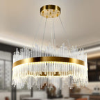 Elegant round gold and crystal chandelier with vertical glass rods, adjustable cables, sleek modern design.