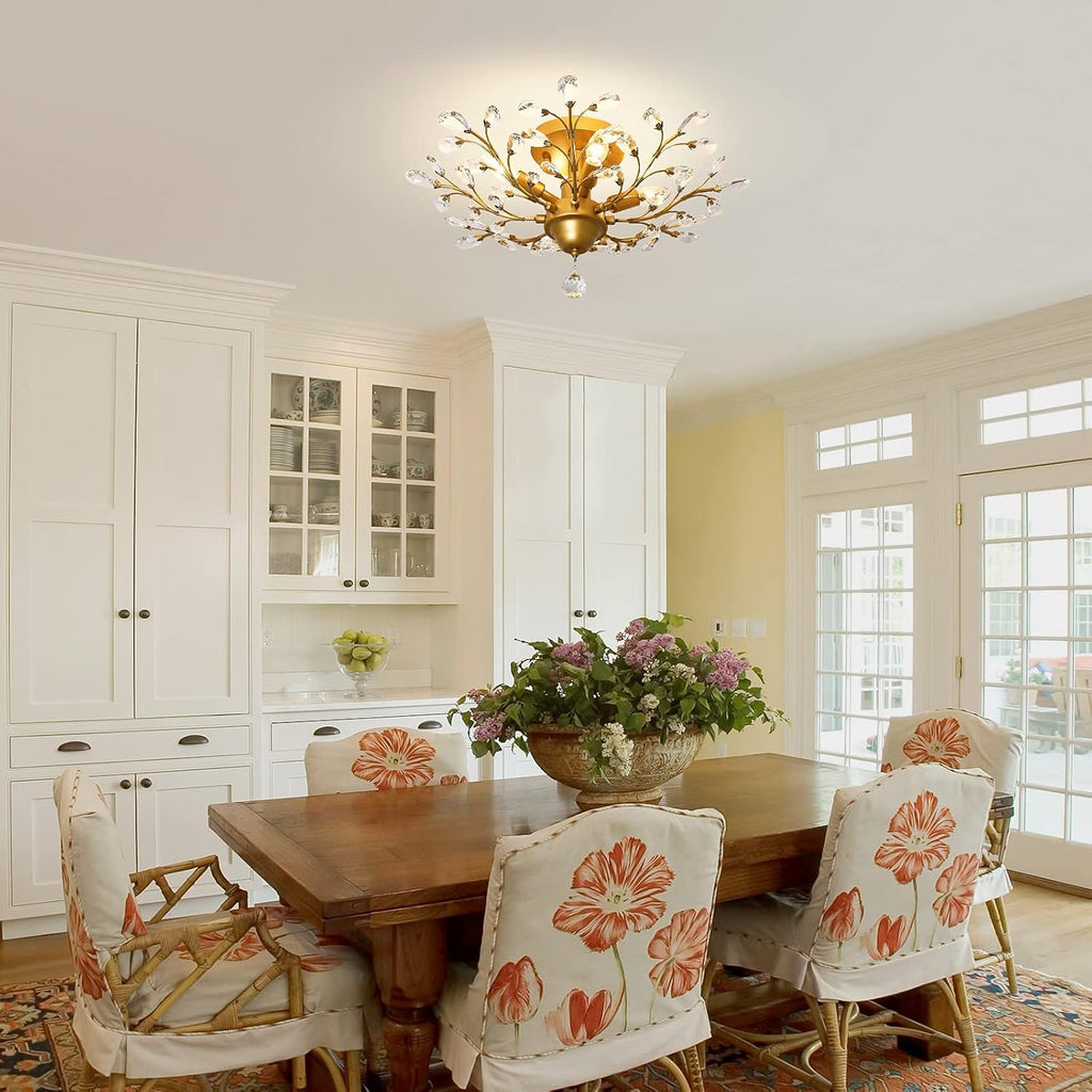 The Maison Ornate K9 Crystal Chandelier in Gold Black Silver Vintage hangs elegantly overhead.
