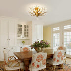 The Maison Ornate K9 Crystal Chandelier in Gold Black Silver Vintage hangs elegantly overhead.