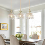 Three Maison Ornate Elegant Adjustable Brass Crystal Pendant Lights with intricate brass and sparkling crystal detailing.