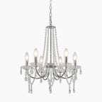 Ornate modern vintage chandelier with eight candle bulbs, crystal strands, teardrop pendants, and adjustable chain.