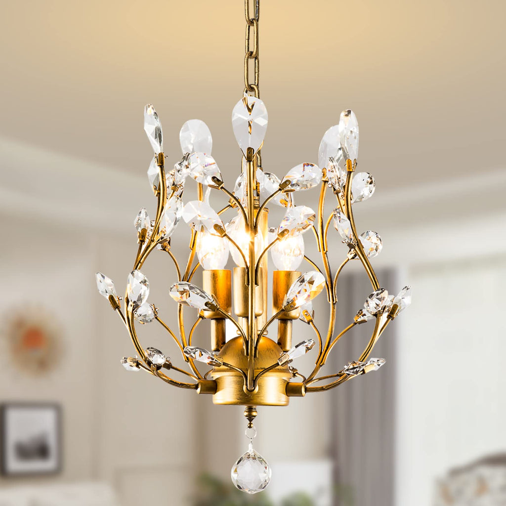 Gold, black, and silver chandelier with K9 crystal drops, leaf accents, and candle-style lights.
