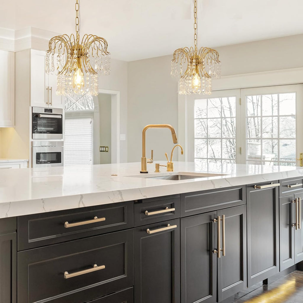 Two Maison Ornate Modern Crystal Water Drop Gold E27 Chandeliers with gold trim and crystal accents.