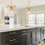 Two Maison Ornate Modern Crystal Water Drop Gold E27 Chandeliers with gold trim and crystal accents.