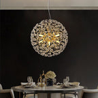 Maison Ornate Modern Crystal Ball LED Raindrop Chrome chandelier emits a warm, elegant glow.