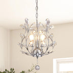 Gold, black, and silver vintage chandelier with three exposed bulbs and ornate crystal-embellished branches.