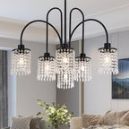 The Crystal Dining Room Chandelier by Maison Ornate features black metal drops and elegant crystal details.