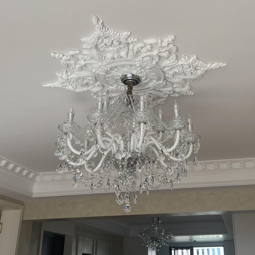 Modern French style white crystal 15-arm chandelier with ornate glass arms and hanging pendants.