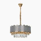 Elegant brass chandelier with gold rod, oval panels, and crystal glass pendants for illumination.