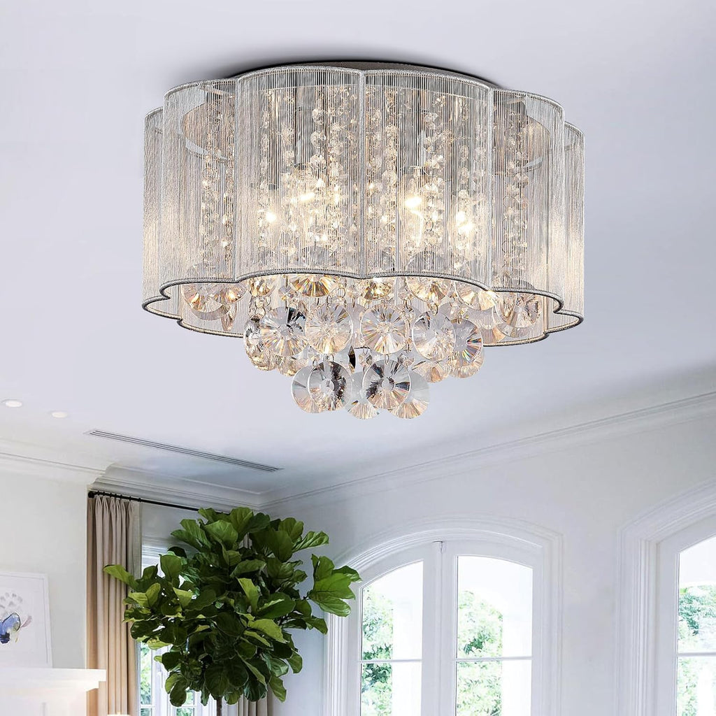 Maison Ornate Modern Round Metal Crystal Chandelier with cascading crystals, emits a warm, inviting glow.
