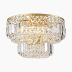 Round flush mount gold chandelier with layered crystal prisms, sparkling reflections, and elegant modern style.