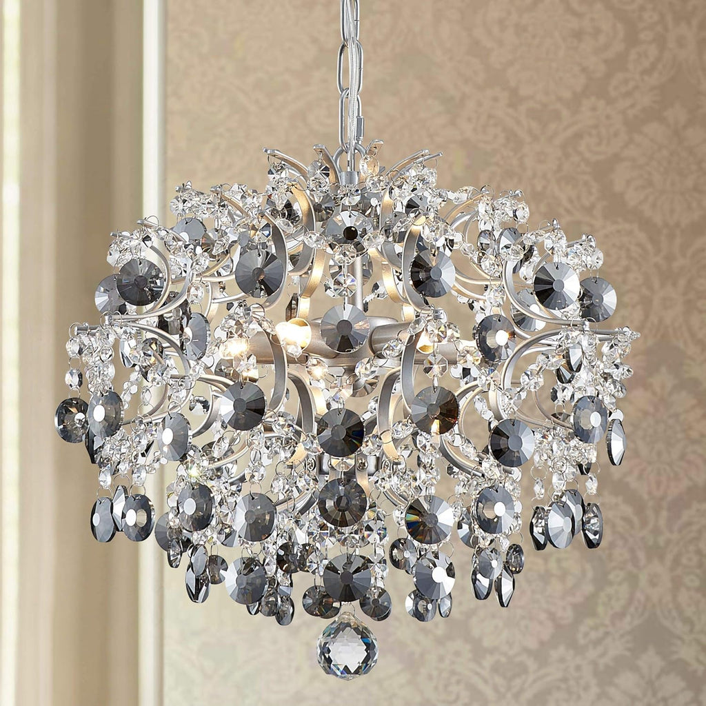 Tiered chandelier with clear and smoky crystals, intricate silver metalwork, raindrop-inspired modern design.