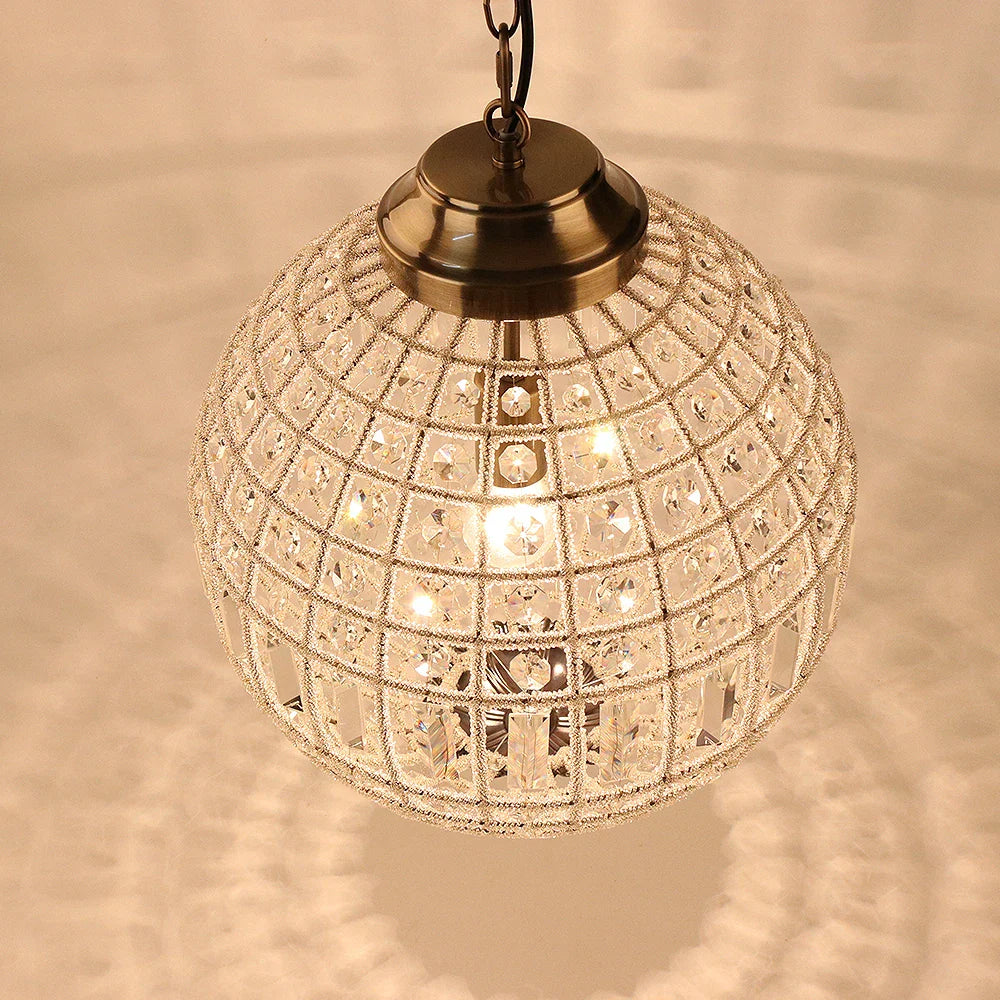 Maison Ornate Adjustable Bronze Crystal Ball Chandelier K9 Vintage Globe with shimmering light effects.