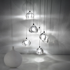 The Maison Ornate Modern LED Crystal Icicle chandelier sparkles softly, showcasing elegant crystal design.