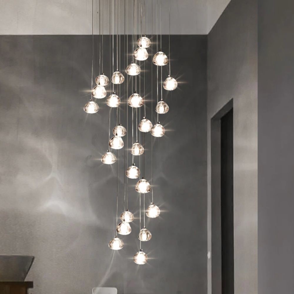 Maison Ornate Modern LED Crystal Icicle chandelier with staggered round glass pendants and artistic reflections.