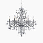 Modern French style chandelier with six candle bulbs, silver frame, sparkling crystal pendants, adjustable chain.