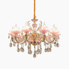 Maison Ornate Art Deco chandelier with gold accents, pink floral glass lamps, and crystal details.