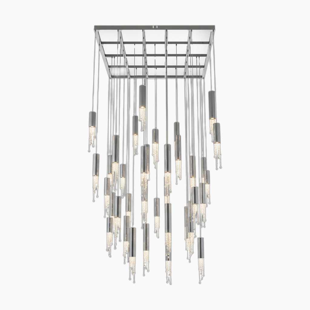 Modern crystal chandelier with cylindrical LED lights, metallic and textured glass, grid ceiling mount.