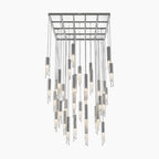 Modern crystal chandelier with cylindrical LED lights, metallic and textured glass, grid ceiling mount.