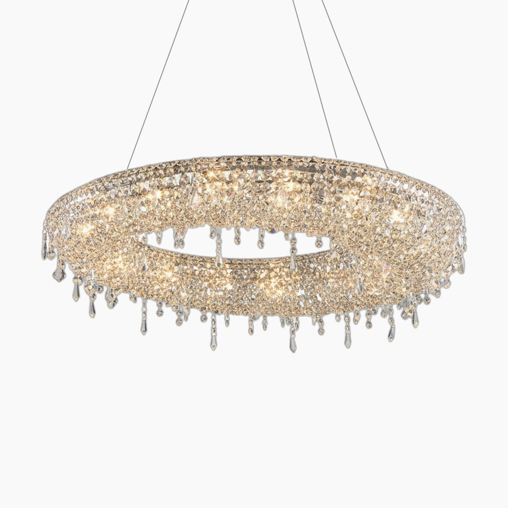 Oval chandelier with teardrop crystals, integrated LED lights, and three slim suspension wires.