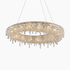 Oval chandelier with teardrop crystals, integrated LED lights, and three slim suspension wires.