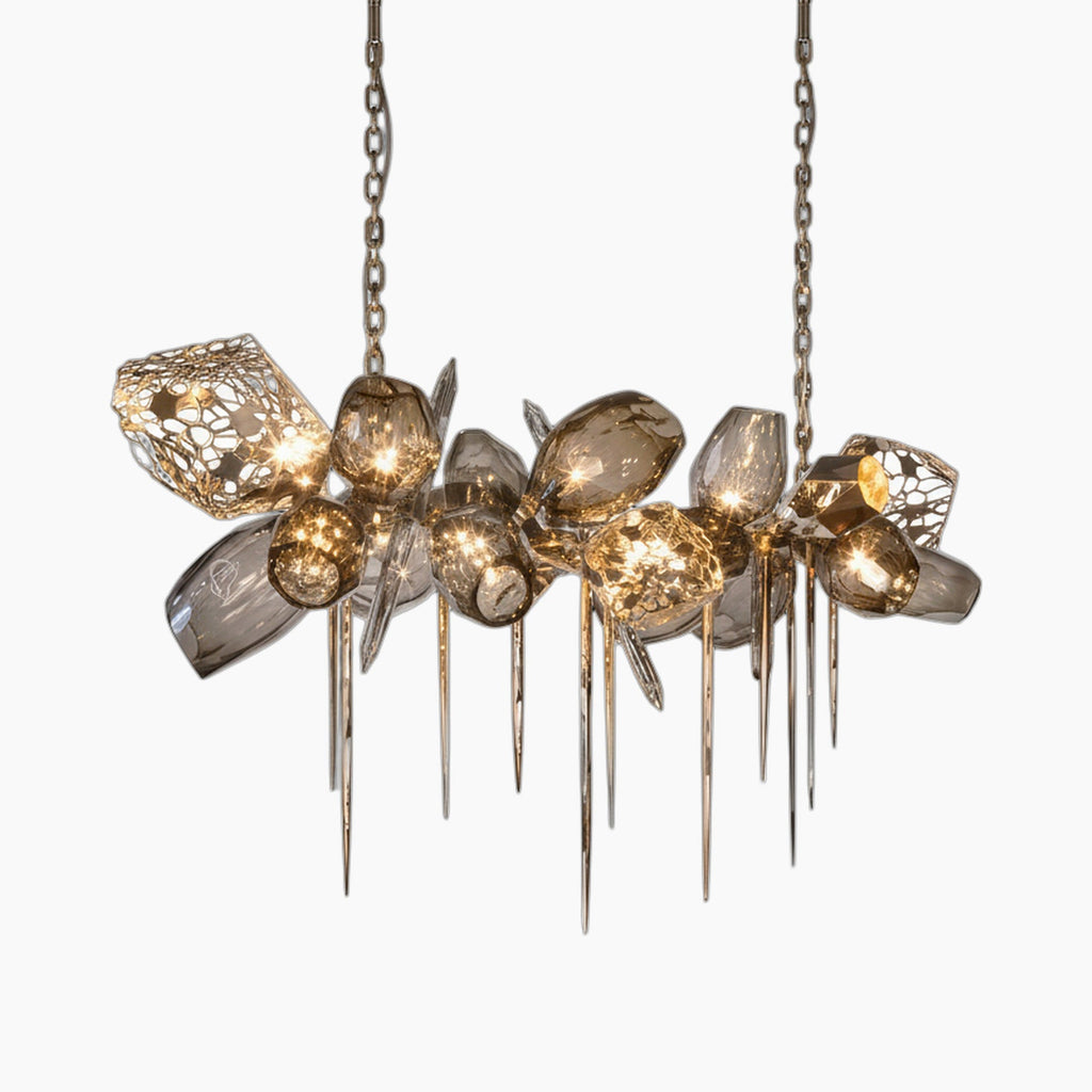 Modern Nordic chandelier with smoky irregular glass, metallic spikes, and twin chains; emits warm light.