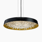 Modern circular chandelier with black edge, gold interior, crystal accents, LED lighting, slim cables.